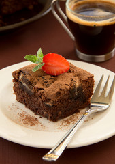 Chocolate brownie cake with strawberries.