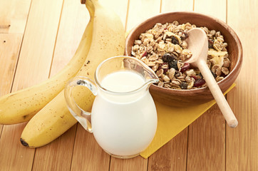 Plate with raw oatmeal on wooden table.