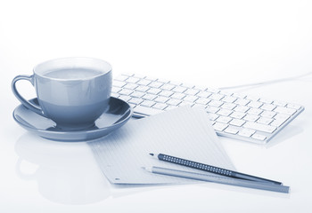 Coffee cup and office supplies