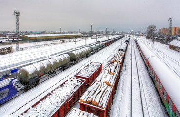 Naklejka na ściany i meble Cargo train platform at winter, railway - Freight tranportation