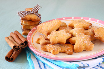 Gingerbread cookies over blue wooden background