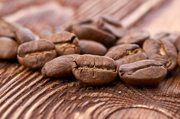Coffee beans on wood background