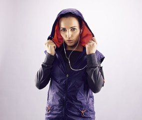 Confident female athlete in hoodie