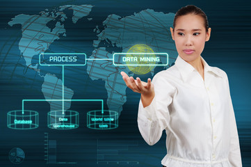 Data mining concept - business woman show virtual screen