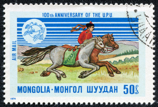 a stamp printed in the Mongolia shows Mongolian dispatch rider