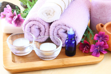 Obraz na płótnie Canvas Spa and wellness setting with natural soap, candles and towel