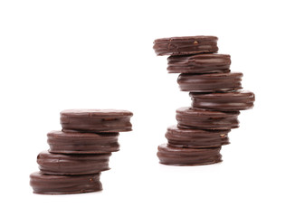 Two stacks of round chocolate biscuit.