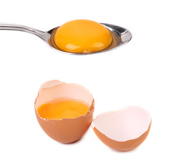 Egg yolk on a silver spoon in shell.