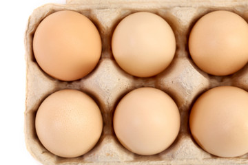 Close up of eggs in box.