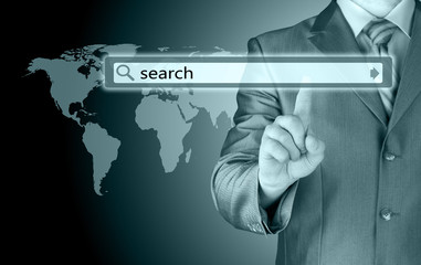 Businessman pushing virtual search bar