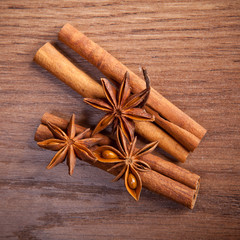 cinnamon sticks and star anise on a wooden background