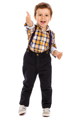 Full lenght portrait of an adorable little boy showing thumbs up