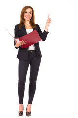 Cheerful businesswoman with ring binder pointing up.