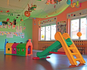 slide and plastic tunnel in the playroom