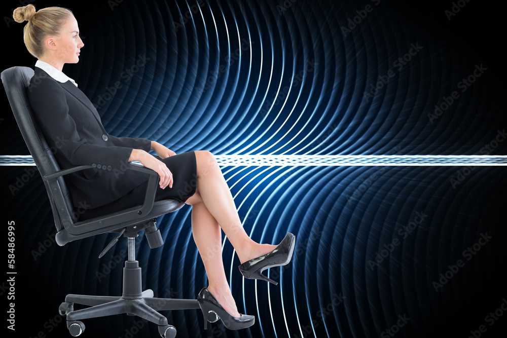 Wall mural composite image of businesswoman sitting on swivel chair in blac