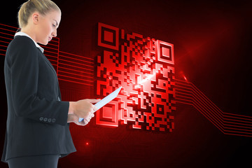 Composite image of businesswoman holding tablet