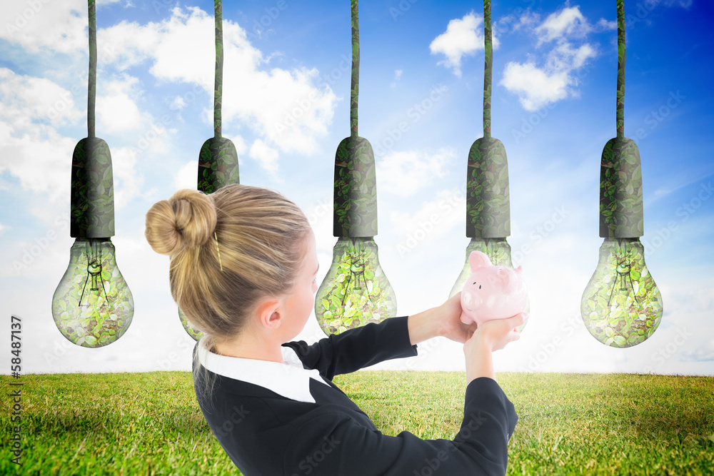 Poster composite image of businesswoman holding pink piggy bank