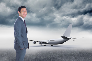 Obraz premium Composite image of smiling businessman standing