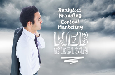 Composite image of unsmiling businessman standing