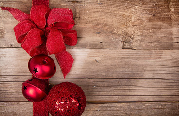Christmas ribbon and ornaments on wooden background