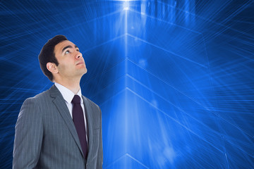 Composite image of unsmiling businessman standing