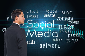 Composite image of serious asian businessman