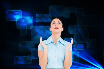 Composite image of concerned young businesswoman praying