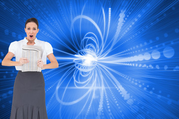 Composite image of shocked stylish businesswoman holding newspap