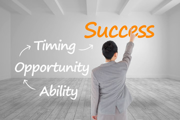 Composite image of asian businesswoman pointing