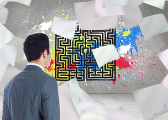 Composite image of businessman standing