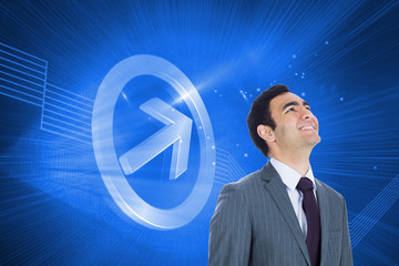 Composite image of smiling businessman standing