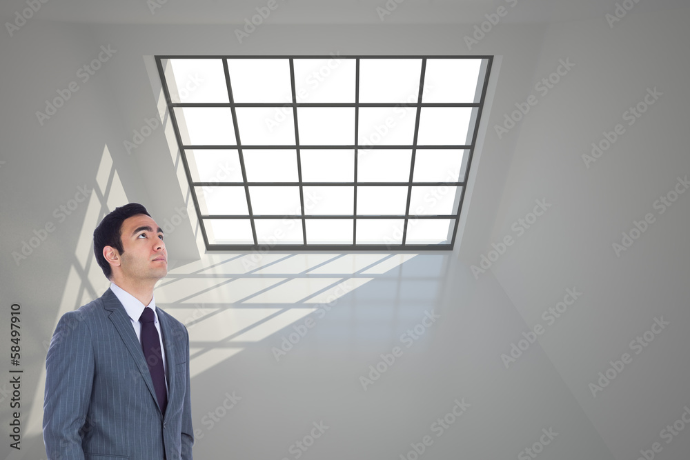 Poster composite image of unsmiling businessman standing