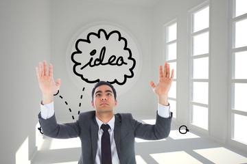 Composite image of unsmiling businessman with arms raised