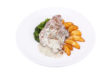 Pork chop, baked potatoes and broccoli