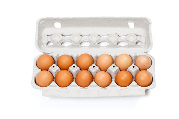 Carton of organic eggs isolated on white