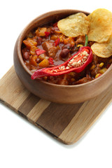 Chili Corn Carne - traditional mexican food, in wooden bowl,