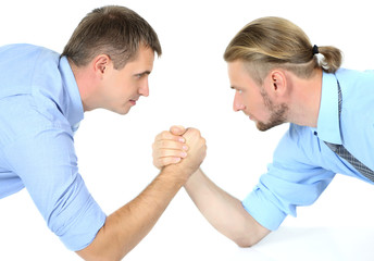 Arm wrestling of business people isolated on white