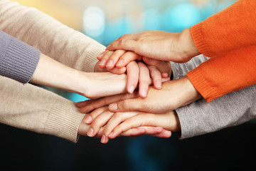 Human hands on bright background