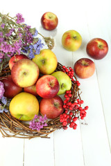 Juicy apples on white wooden table