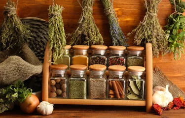 Garden poster Aromatic dried herbs, spices and and pepper, on wooden background