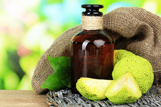 Osage Orange fruits (Maclura pomifera) and medicine bottle,