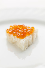 Little sendwich with Caviar on big plate