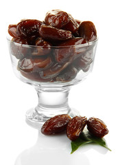 Dried dates in glass bowl isolated on white