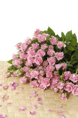 bouquet rose on bamboo mat