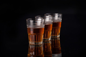 three glasses of liquor