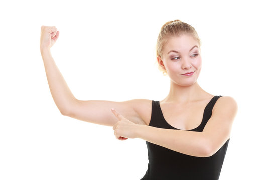 Fitness woman showing energy flexing biceps