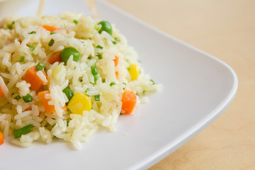 fried rice with butter on white dish