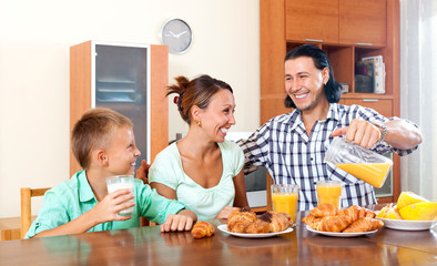 Happy  family having breakfast in the morning