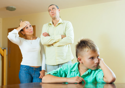 teenager son and parents after quarrel at home