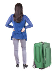 back view of standing young beautiful  brunette woman.